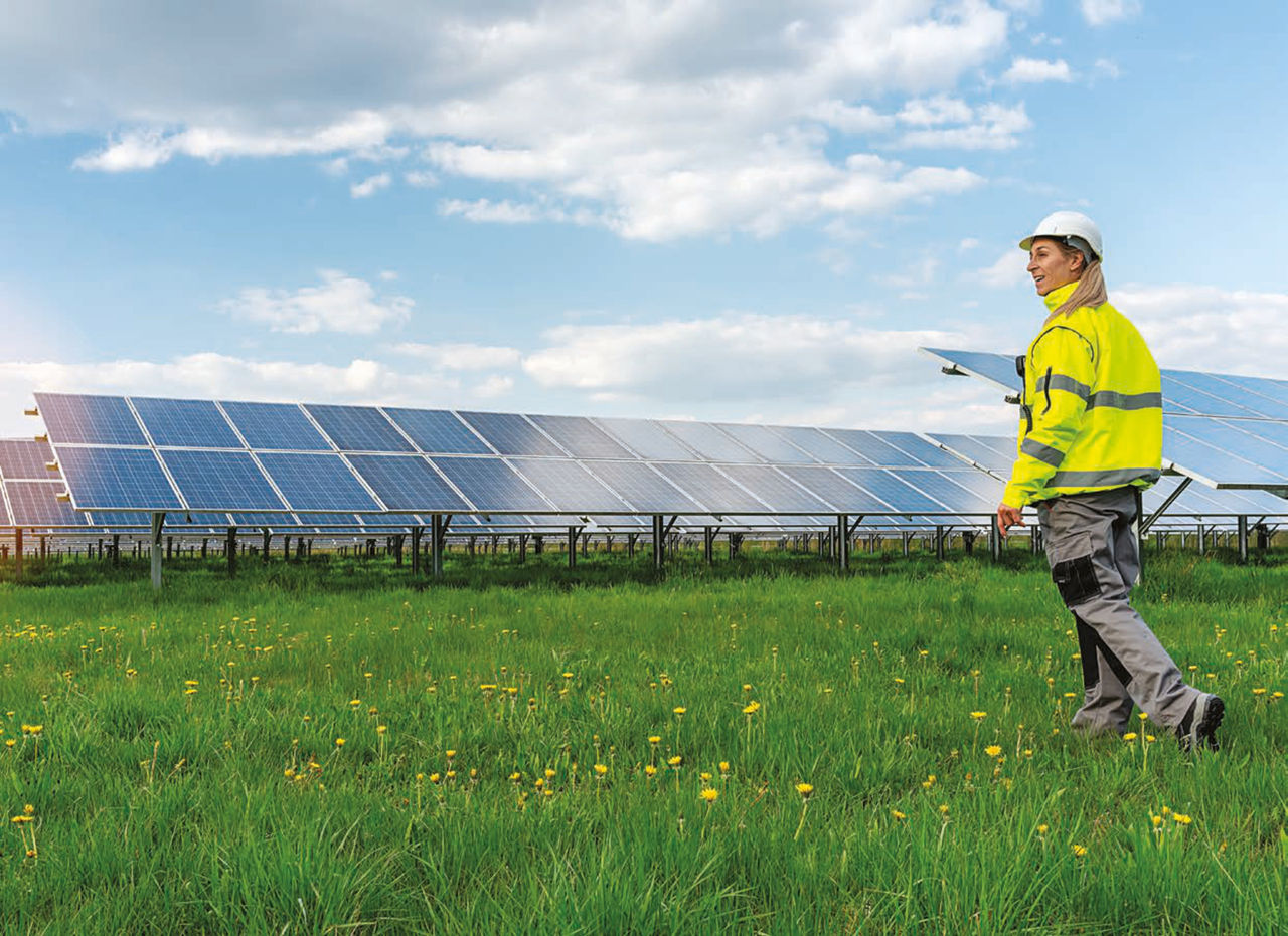 Solar panels with woman in construction hat